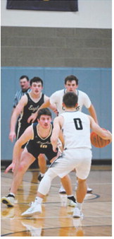 Colton Bailly putting pressure on the ball Friday night against Nelson County. Photo by Ashley Schafer