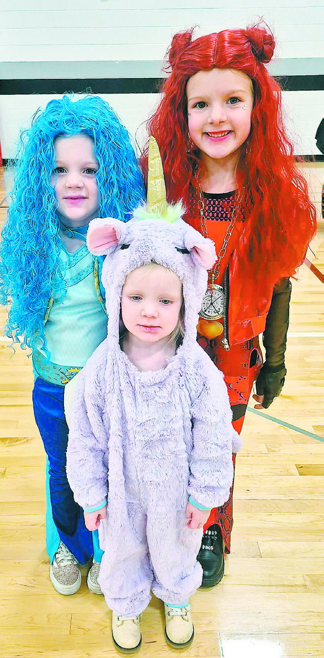 Isla, Ingrid, and Quinn Ullyott dressed up at the Spooktacular event.