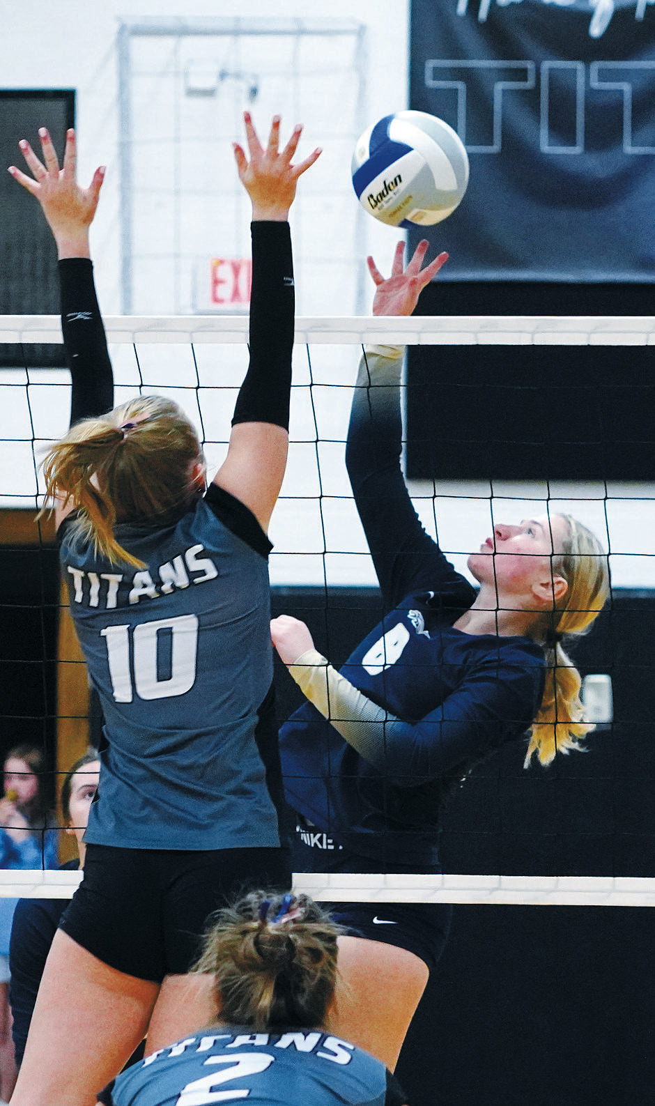 Katelyn Bjornstad sends the ball over the Titan's Easton Larsdon in Edinburg Oct 24. Photo by Larry Stokke.