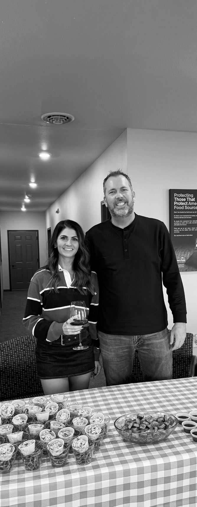 Tina Mikkelsen and Russel Stremick at Farmers Union Insurance during Langdon’s annual Wine Walk.