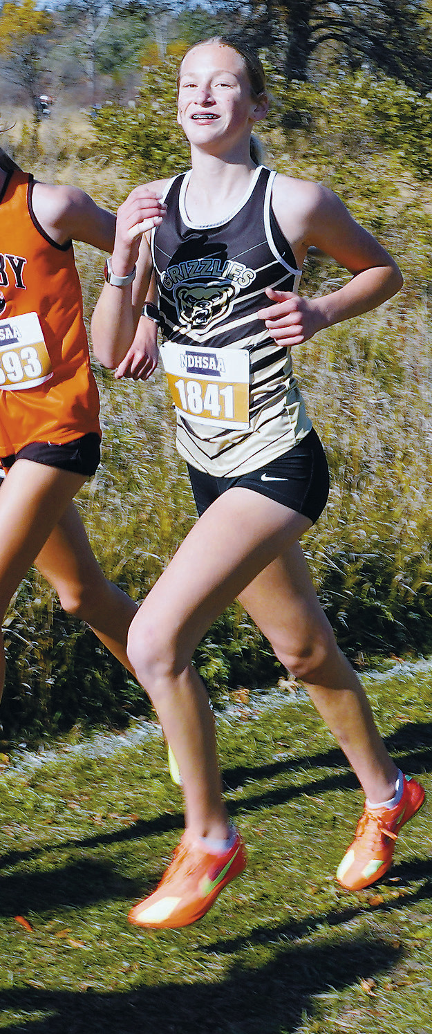 Maci Puppe had a great run at State Cross County, placing 44th out of 267 runners. Photo by Larry Stokke.