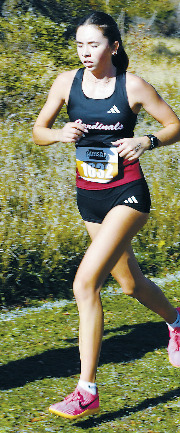 Olivia Lorenz ran to an 86th place finish at the State Cross Country Meet in Jamestown. Photo by Larry Stokke.