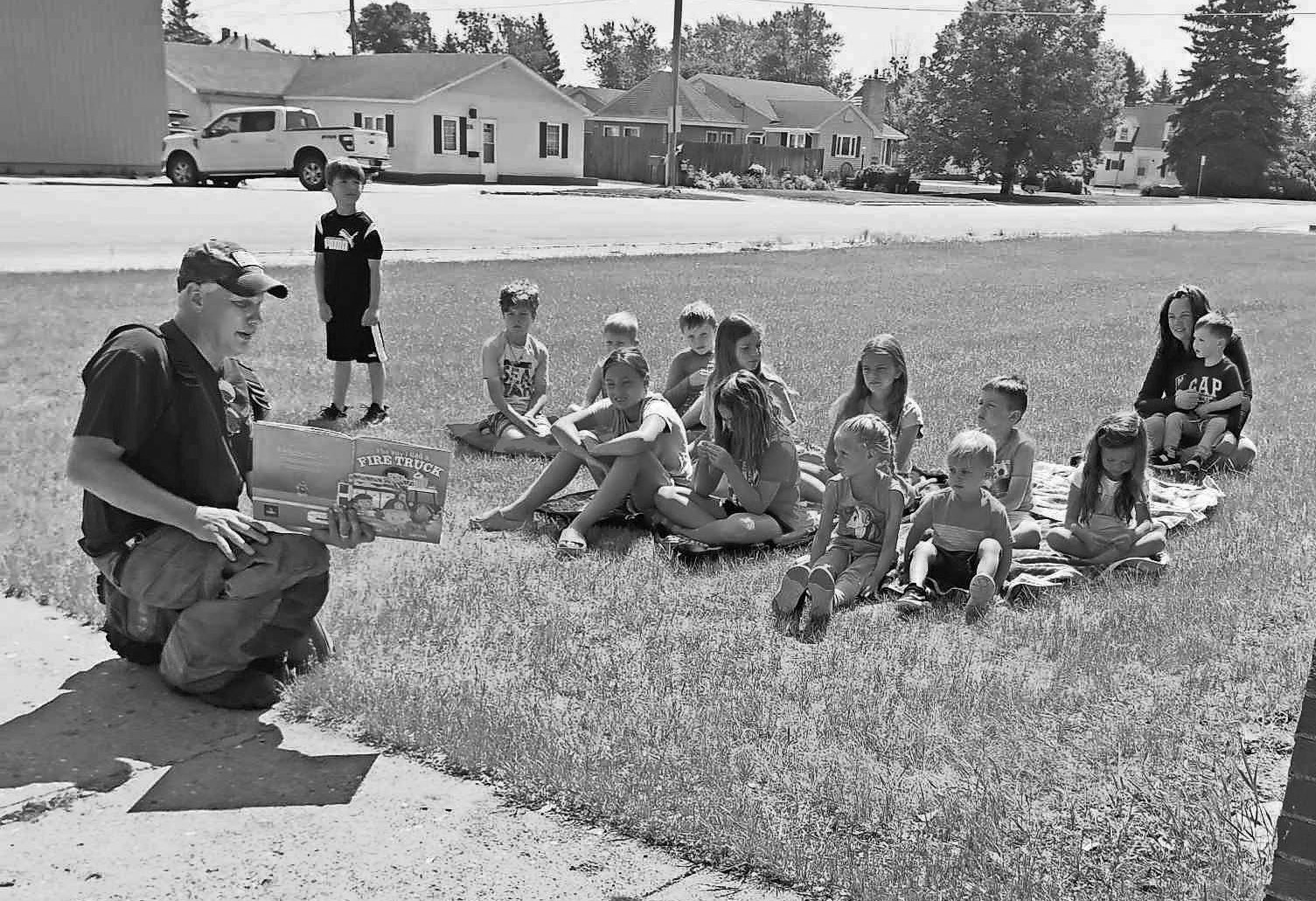 Jeff Sims reads to children as part of the Summer Reading Program at Walhalla Public Library.