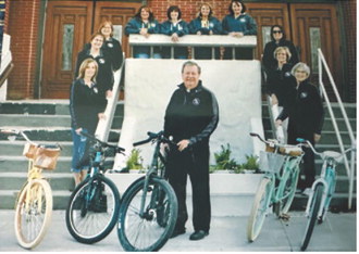Father Phil Ackerman poses with members of the Padre Pedal Pushers outside St. Alphonsus Catholic Church in Langdon. Ackerman started the cycling group during his time as pastor, and the friendships formed through the rides remain among his favorite memories of his years in the community. Submitted photo