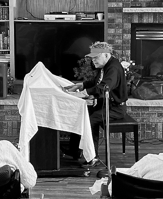 Gordy “Crazy Fingers” playing with thick gloves on, as well as a sheet covering the piano keys