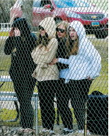 The Lady Grizzlies’ fan group cheers on the team throughout the game. Photo by Larry Stokke
