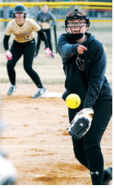 Nadia Lewis eyes the batter and delivers a strike in the Cardinals’ win over the PCN Grizzlies. Photo by Larry Stokke