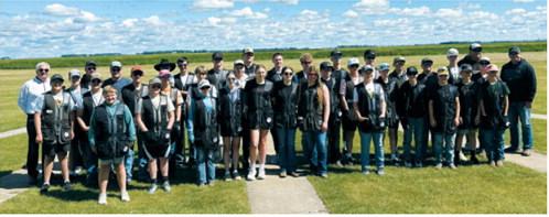The Cardinal Clays Trap and Skeet team members and coaches gather for a group photo at State Trap in Horace on June 20 . Submitted photo