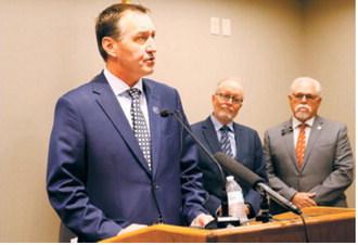 Rep. Jonathan Warrey, R-Casselton, chair of the interim Artificial Intelligence and Data Center Committee, speaks during a press conference at the Capitol on June 25, 2026. At right are former North Dakota University System Chancellor Mark Hagerott and Sen. Mike Wobbema, R-Valley City. (Photo by Michael Achterling/North Dakota Monitor)
