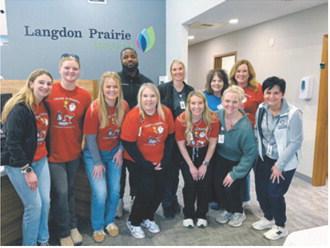 Representatives from Team Scrappy, Langdon Prairie Health and Cavalier County Public Health gather during the recent free skin-check event promoting melanoma awareness and early detection. Submitted photo