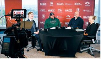 North Dakota Superintendent Levi Bachmeier, left, and superintendent candidate Tracy Foss, right, check the camera locations next to Plain Talk Podcast hosts Rob Port, center-left and Chad Oban, center-right, at Bismarck State College on Oct. 13, 2026, before beginning their debate for superintendent for the Department of Public Instruction. (Photo by Michael Achterling/North Dakota Monitor)