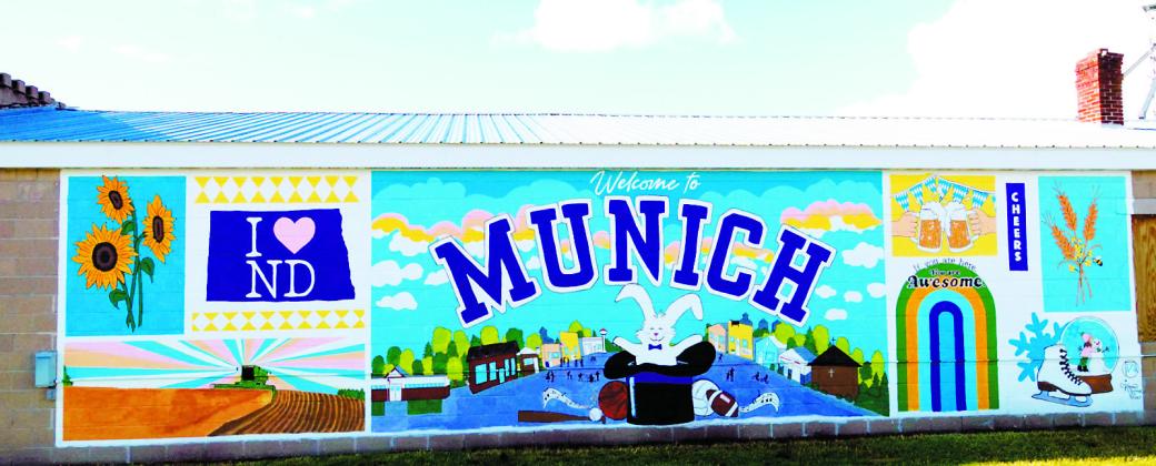Munich's new downtown mural celebrates the community's history, heritage and agricultural roots through colorful images representing agriculture, local traditions, recreation and small-town life. Photo by Larry Stokke
