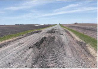 Heavy truck traffic and increased vehicle volumes during the Highway 1 construction project have contributed to deteriorating conditions on some township roads, prompting concerns from local officials and residents. Submitted photo