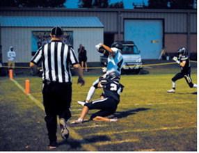 North Border’s Jaxon Suedel catches up with the ball carrier downfield and brings the run to a stop. Photo by Ashley Schafer