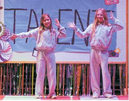 Students perform a choreographed dance number during the annual elementary talent show. The event showcased a variety of performances ranging from music and dance to comedy and other special talents. Photo by Larry Stokke