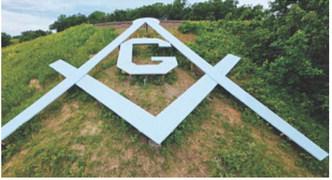 Walhalla’s Masonic square-and-compasses emblem remains a prominent hillside landmark more than 75 years after it was built in 1951. Recent work has helped preserve the structure and keep the longtime symbol visible for future generations. Photo courtesy of Duane Symons