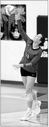 Erika Bakke sends a serve over the net as the Lady Cardinals take on Minnewaukan-Warwick on Oct. 16. Photo by Larry Stokke