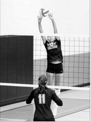 Langdon Area-Munich’s Aubrey Badding sends the ball over the net with a two-handed tip against Park River during a scrimmage Saturday, Aug. 22, in Thompson. Photo by Larry Stokke