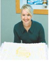 Elizabeth Sillers, FNP-C, poses with a cake celebrating her 25 years of service at Langdon Prairie Health during an open house held in her honor Sept. 16 at the clinic in Langdon.