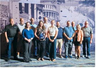 Members of the North Dakota Rural Water Systems Association pose with the Outstanding Achievement in Member Services award during the 2026 WaterPro Conference in Phoenix. The National Rural Water Association presented the award Sept. 15 in recognition of NDRWSA’s service and support to member water and wastewater utilities.
