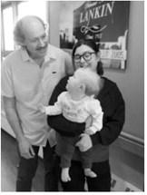 Dr. Joel Johnson visits with baby Allara and her mother, Samantha Kartes, during Allara’s recent well-child visit at First Care Health Center. Johnson delivered Allara during an emergency breech birth at the Park River facility on May 30, 2025. Photo courtesy of First Care Health Center