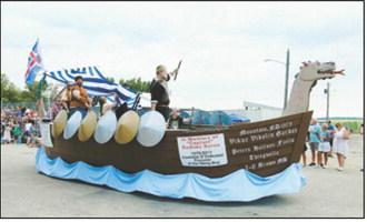A Viking ship float honoring the late “Captain” Rodney Byron makes its way through Mountain during the Deuce of August parade. Photo by Larry Stokke
