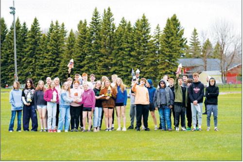 Eighth-grade students gather on the football practice field before the annual Bottle Rocket Challenge, a hands-on engineering project in Rich Olson’s Exploring Technology class. Photo by Larry Stokke
