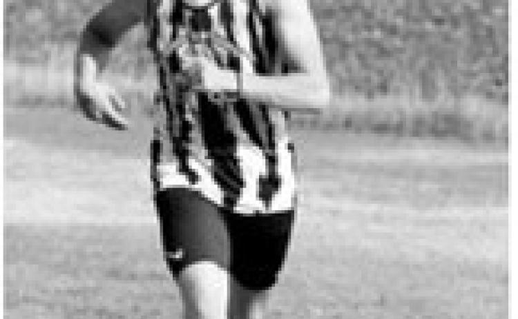 Pembina County North’s Nash Fitzsimonds races to a sixth-place finish with a time of 18 minutes, 13.17 seconds during the cross-country meet Tuesday, Aug. 25, in Northwood. Photo by Larry Stokke