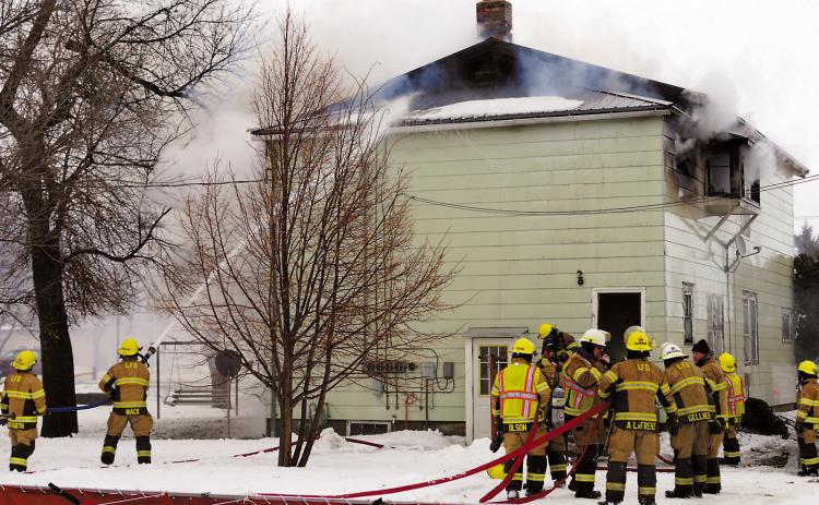 Fire crew members attempt to put out Sunday's blaze on 3rd Street which broke out around 4:30 p.m. Photo by Larry Stokke.