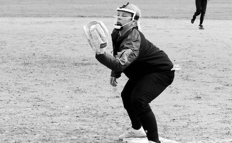 Claire Mehlhoff makes a catch at first base for the third out against Northern Lights on April 30 in Munich. Photo by Larry Stokke