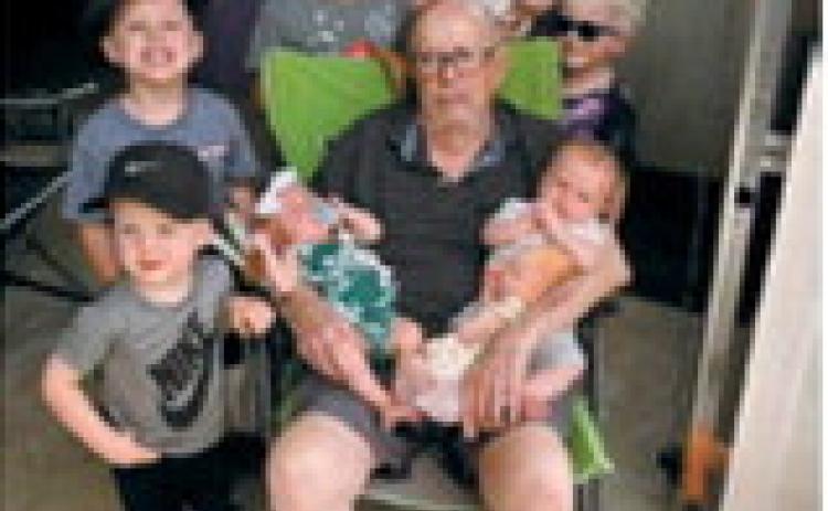 Great-grandpa Leo Beauchamp gathers with his great-grandchildren Torger and Ivan Olson; Cooper, Everett and Quinn Braunberger; Mason and Ava Schwartz; and Eleanore Beauchamp on Aug. 25 in Olga. Leo saves quarters in pill bottles for each of his great-grandchildren. Photo submitted by Diane Hanson