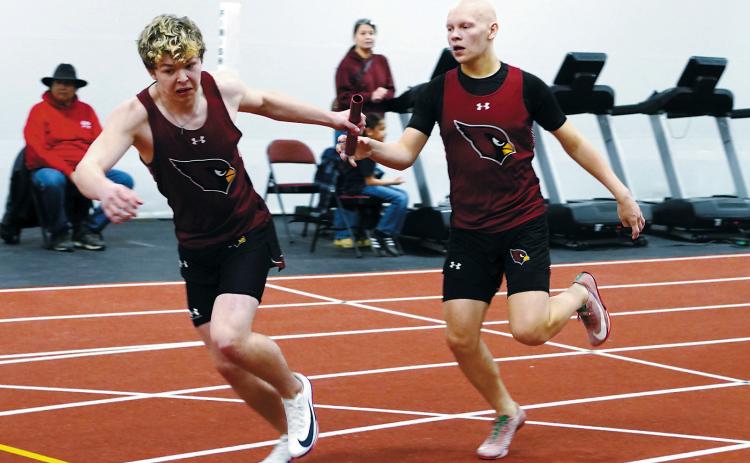 In the 4X200-meter relay, Gavin Trottier hands off to Braxton Lindseth, who was also named Performer of the Meet for the Cards. Other relay members were Evan Ottem and Brett Bryant. The relay team took fourth place. Photo by Larry Stokke