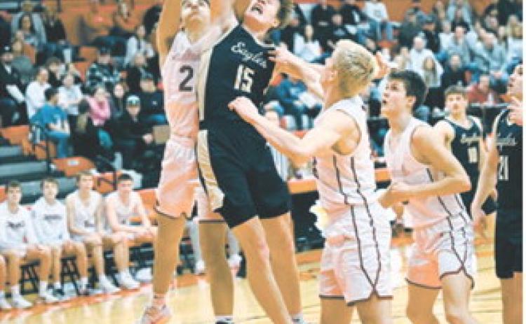 Garret Willits jumps and battles for the ball in the win over the Cardinals Monday night. Photo by Ashley Schafer