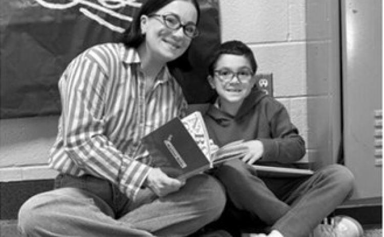 Jessi Sunderland reads with her son, Hayes. Photo by Sarah Overby