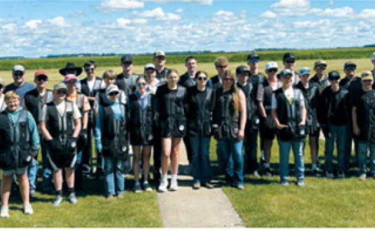 The Cardinal Clays Trap and Skeet team members and coaches gather for a group photo at State Trap in Horace on June 20 . Submitted photo