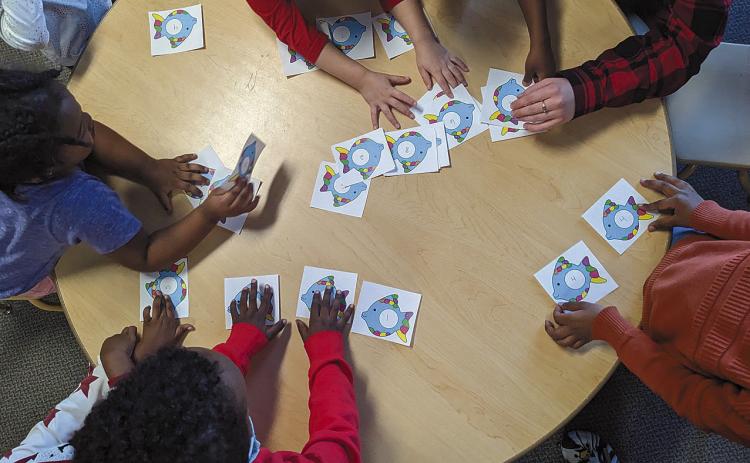 According to analysis of the most recent data by Kids Count North Dakota, child care capacity only meets 81 percent of the needs in the state with costs running close to $10,000 per year for infant day care. Here, children play a numbers game at Jasmin Child Care and Preschool in Fargo. Photo courtesy of Jasmin Child Care.