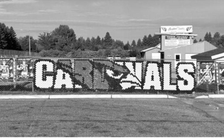 Banners recognizing senior members of the Langdon Area-Munich Cardinals football team line the fence near the football field in Langdon. Photo by Sarah Overby