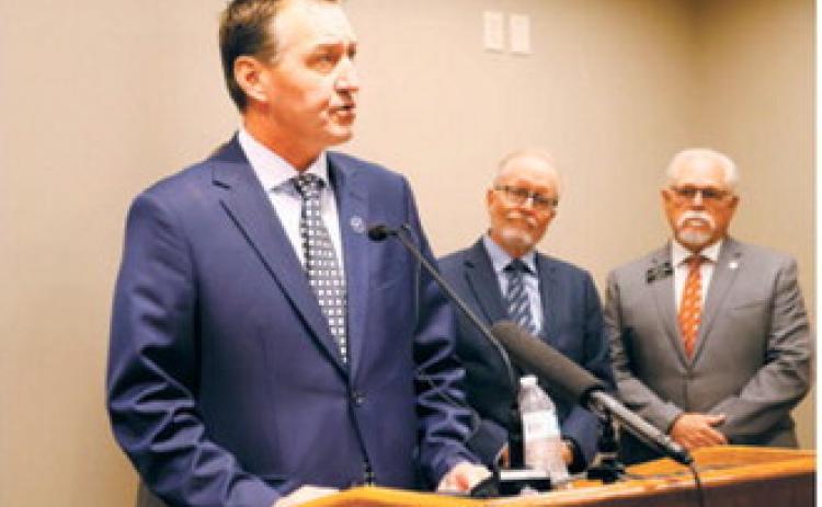 Rep. Jonathan Warrey, R-Casselton, chair of the interim Artificial Intelligence and Data Center Committee, speaks during a press conference at the Capitol on June 25, 2026. At right are former North Dakota University System Chancellor Mark Hagerott and Sen. Mike Wobbema, R-Valley City. (Photo by Michael Achterling/North Dakota Monitor)