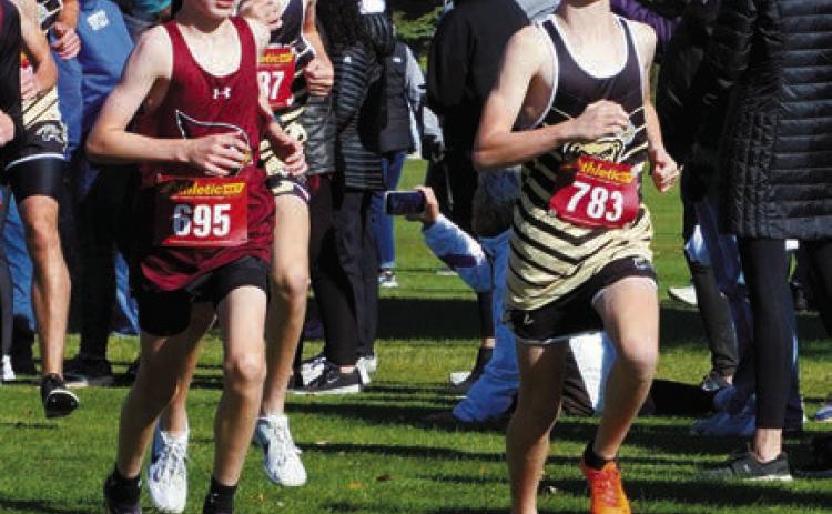 Dyson Askvig and Micah Crosby run side by side through the course in Rugby. Photo by Larry Stokke.