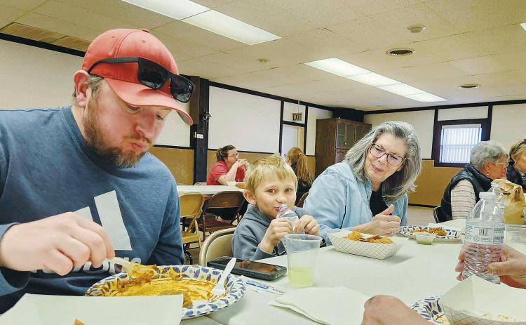 The Belanus family enjoying their dinner. Photo by Hilary Nowatzki.