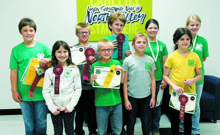 Front row (L-R) Olive Truver, Silas Norrell, Sadie Kennedy, Olivia Olimb; back row: Oscar Hunter, Levi Norrell, Gary Olimb, Chloe Hunter, and Stella Norrell.