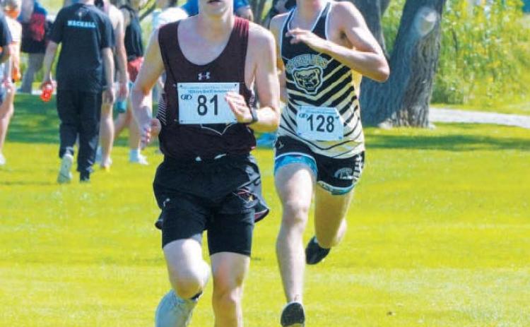Cardinal Noah Foster followed by Pembina County North’s Mason Heller at the HCV Meet. Photo by Larry Stokke.