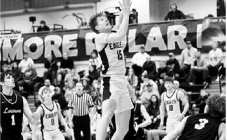Garret Willits goes up strong for the layup. Photo by Ashley Schafer