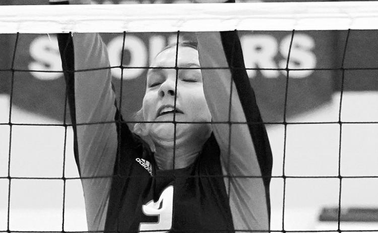 Jocelyn Anderson with one of her seven kills against Mayport C-G in Grafton on Nov. 11. Photo by Larry Stokke.