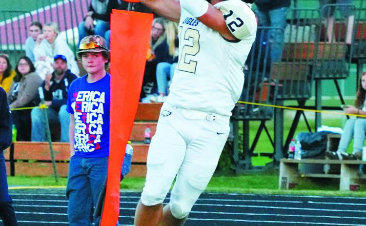 Weston Cosley with one of his two touchdowns and 5 catches for 102 yards in the Eagles win over St John on Sept .27. Photo by Larry Stokke.