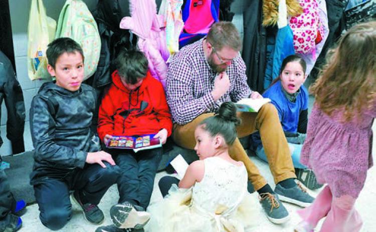 Students spending time reading for National Reading Month. Photo by Larry Stokke.