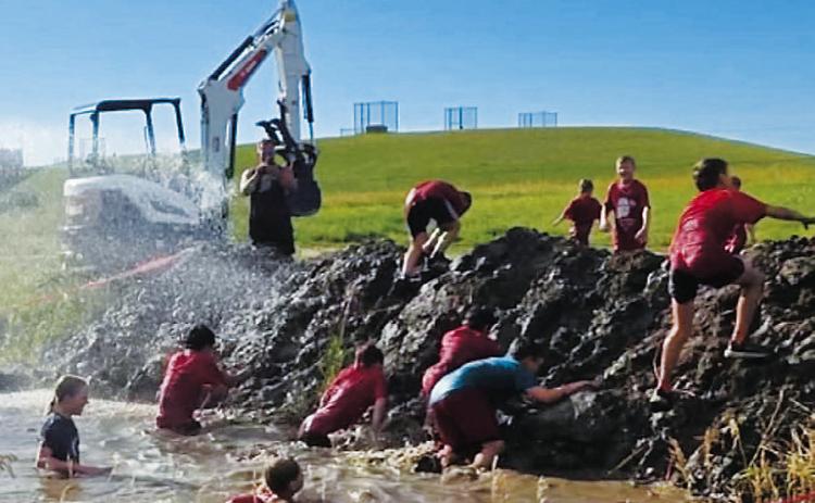 Youth racers brave the mud pits at the Medieval Rush in early August 2025. Photo provided by Tanner Schweitzer.