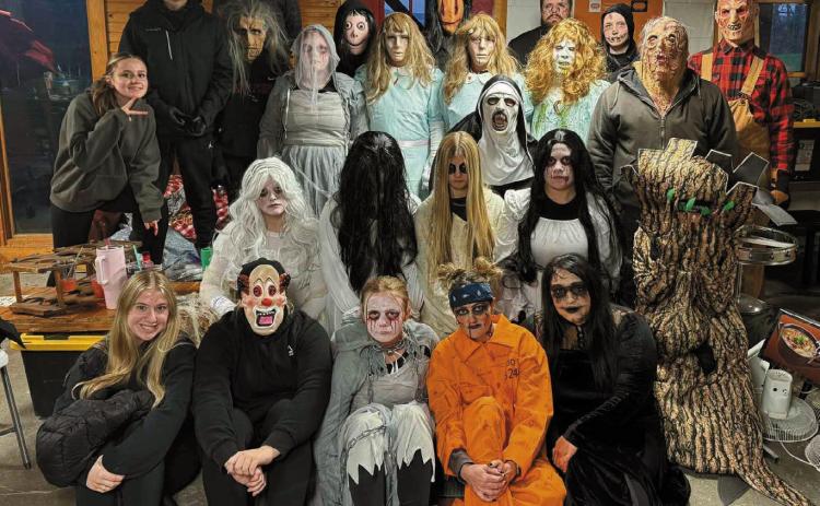 The team of ‘scarers’ who helped make the haunted house fundraiser a frightening success.