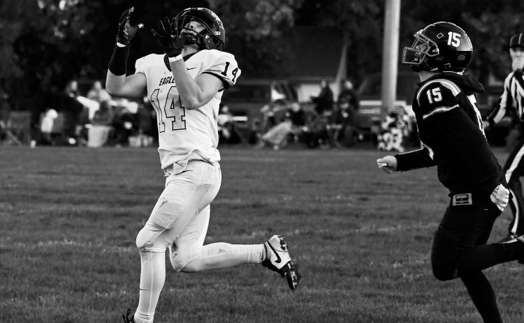 Colton Bailly pulls down the reception to keep the drive alive.