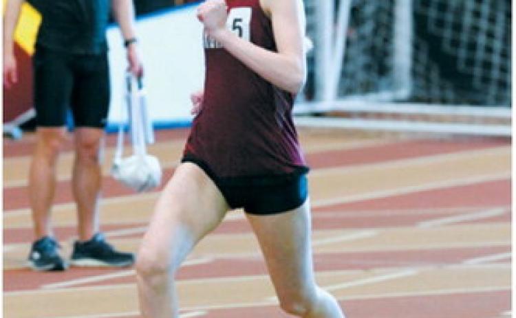 Mya Swanson runs to a sixth place finish in the 600 in Grand Forks on March 27. Photo by Larry Stokke